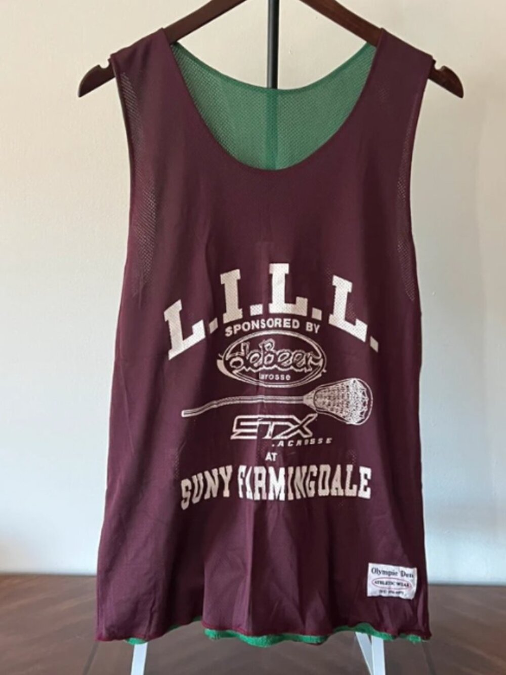 Green and maroon reversible lacrosse pinnie